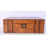 A large wooden inlaid writing box with central brass plaque 17.5 x 50 x 26cm.