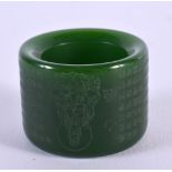 A CHINESE JADE ARCHERS RING 20th Century. 2.25 cm wide.
