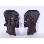 A pair of African hardwood wall hangings tribal heads 28 x 2 cm (2)
