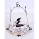 A VINTAGE SILVER PLATED CURLING CRUET SET. 334 grams not inc glass. 17 cm x 16 cm.