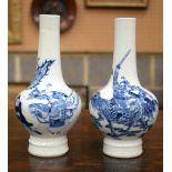 A PAIR OF 19TH CENTURY CHINESE BLUE AND WHITE PORCELAIN BULBOUS VASES bearing Kangxi marks to base,