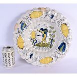 A VERY RARE 17TH CENTURY DELFT TIN GLAZED SCALLOPED BOWL painted with a winged figure within a lands
