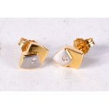 A PAIR OF YELLOW METAL EARRINGS. 2.1 grams. 0.75 cm x 0.5 cm.