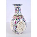 A Chinese porcelain vase decorated with open work panels and blossom 28 cm.