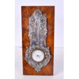 A FINE ART NOUVEAU FRENCH SILVER MOUNTED WALNUT DESK BAROMETER decorated with repousse foliage. 27 c