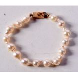 A 14CT GOLD AND PEARL BRACELET. 18 cm long.