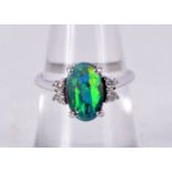 A 14CT WHITE GOLD, DIAMOND AND OPAL RING. Stamped 475, Size L, weight 3.3g