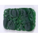 A Carved jade fruiting pod plaque 11 x 7 cm.