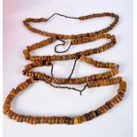 FOUR MIDDLE EASTERN AMBER TYPE PRAYER BEAD NECKLACES. 589 grams. Longest 80 cm. (4)