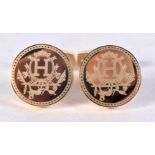 A pair of Hermes gilt metal cuff links .