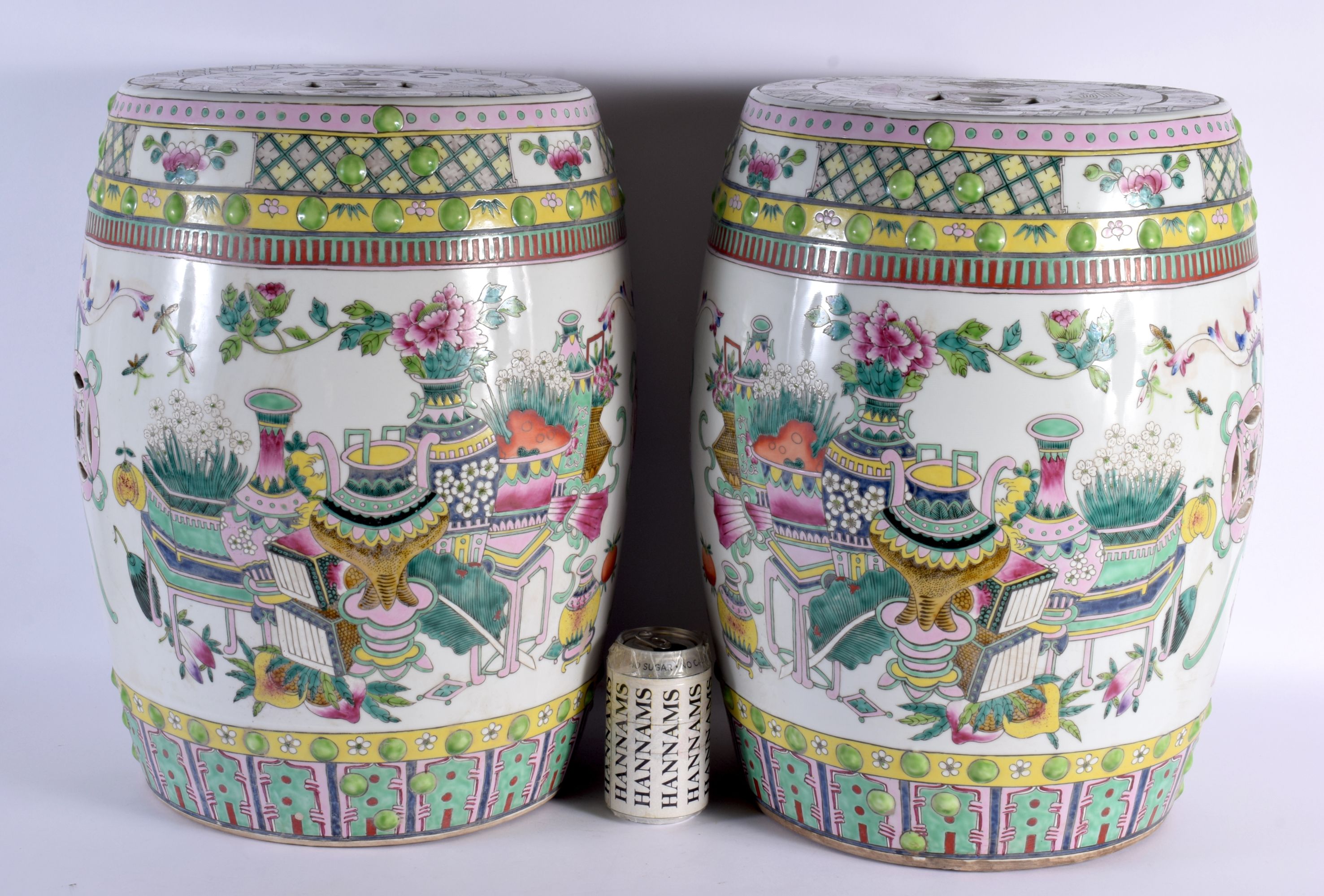 A LARGE PAIR OF CHINESE REPUBLICAN PERIOD FAMILLE ROSE GARDEN SEATS painted with objects. 46 cm x 25