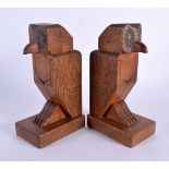 A PAIR OF 1930 CARVED WOOD ROTATING HEAD OWL BOOK ENDS. 21 cm high.