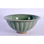 AN EARLY CHINESE CELADON SCALLOPED TEABOWL probably Sung. 10.5 cm diameter.