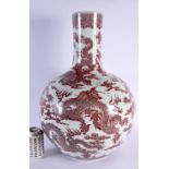 A LARGE CHINESE IRON RED GLAZED PORCELAIN BULBOUS VASE probably 19th century, bearing Qianlong marks