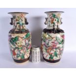 A LARGE PAIR OF 19TH CENTURY CHINESE CRACKLE GLAZED FAMILLE VERTE VASES painted with warriors in bat