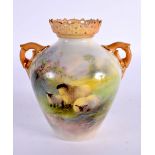 Royal Worcester two handled vase, shape G405, painted with three sheep in heathered landscape under