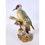 A German Hutschenreuther bird on a branch.26 cm.