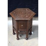 A Liberty Moorish style carved wooden table with mother of pearl insert 52 x 49 cm.