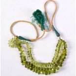 A PERIDOT BEAD NECKLACE. 70 cm long.