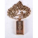 A 9CT GOLD INGOT NECKLACE upon a 9ct gold chain. 43.7 grams. 52 cm long, pendant 3.5 cm x 1.5 cm.