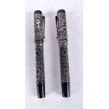 A PAIR OF SILVER OVERLAID PENS. 85 grams. 13 cm x 2 cm.