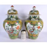 A LARGE PAIR OF CHINESE FAMILLE JAUNE VERTE PORCELAIN VASES AND COVERS 20th Century. 44 cm x 16 cm.