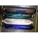 FOUR ANTIQUE PAINTED GLASS ROLLING PINS. 35 cm wide. (4)