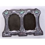 AN ART NOVEAU STYLE SILVER AND ENAMEL DOUBLE PHOTO FRAME. Stamped Sterling, 7.9cm x 11.1cm