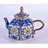 A LATE 19TH CENTURY CHINESE CANTON ENAMEL TEAPOT AND COVER decorated with foliage. 8.5 cm wide.