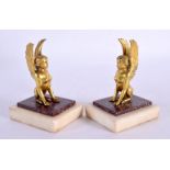 A PAIR OF LATE 18TH CENTURY CONTINENTAL ORMOLU AND PORPHYRY FIGURES modelled as winged females. 9 cm