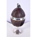 A RARE 18TH CENTURY SWEDISH SILVER MOUNTED COCONUT CUP AND COVER with figural terminal. 171 grams. 1
