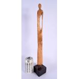 A STYLISH CONTEMPORARY CARVED WOOD FIGURE OF A FEMALE. 49 cm high.