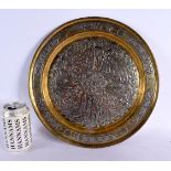 A LARGE 19TH CENTURY MIDDLE EASTERN SILVER INLAID CIRCULAR PLATE decorated with a floral motif encas