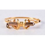 A 9CT GOLD BANGLE. 15.4 grams. 5.5 cm x 4.5 cm.