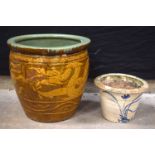 A large glazed pottery garden pot together with a smaller pot 47 x 50cm (2).