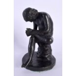 A 19TH CENTURY EUROPEAN BRONZE FIGURE OF THE THORN PICKER modelled upon a circular base. 11 cm high.