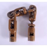 A RARE FOLK ART CARVED WOOD TREEN WHISTLE. 31 cm long.