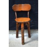 A Back Forest tri legged chair 71 x 38 x 36 cm.