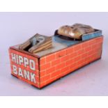 A VINTAGE TIN PLATE WIND UP HIPPO MONEY BOX. 18 cm x 5 cm.