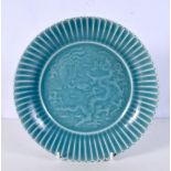 A Chinese porcelain Celadon petal shaped dish decorated in relief with Dragons 5 x 23 cm .