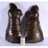 A PAIR OF 18TH/19TH CENTURY CONTINENTAL SUIT OF ARMOUR LEG GUARDS probably German or Italian. 70 cm