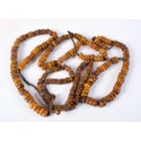 FOUR MIDDLE EASTERN AMBER TYPE PRAYER BEAD NECKLACES. 600 grams. Longest 86 cm. (4)