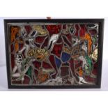 A RARE STAINED GLASS WINDOW in the manner of Marc Chagall, depicting demonic figures in various purs