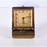 A small Jaeger Le Coultre brass travel clock 8 x 2 cm .