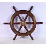 A wooden and brass bound ships wheel 67 cm Diameter.