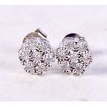 A PAIR OF SILVER AND DIAMOND EARRINGS. 1.5 grams. 0.7 cm wide.