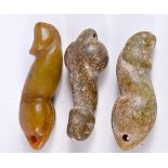 A collection of carved hardstone penis pendants 10 cm (3).