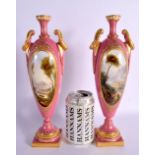 A FINE PAIR OF 19TH CENTURY ROYAL WORCESTER TWIN HANDLED PINK GROUND VASES by Harry Davis, painted w
