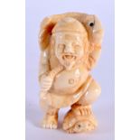 A JAPANESE CARVED BONE NETSUKE. 5 cm x 2.75 cm.