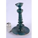 A LARGE 17TH/18TH CENTURY PERSIAN TURQUOISE GLAZED OIL LAMP engraved with foliage and motifs. 38 cm